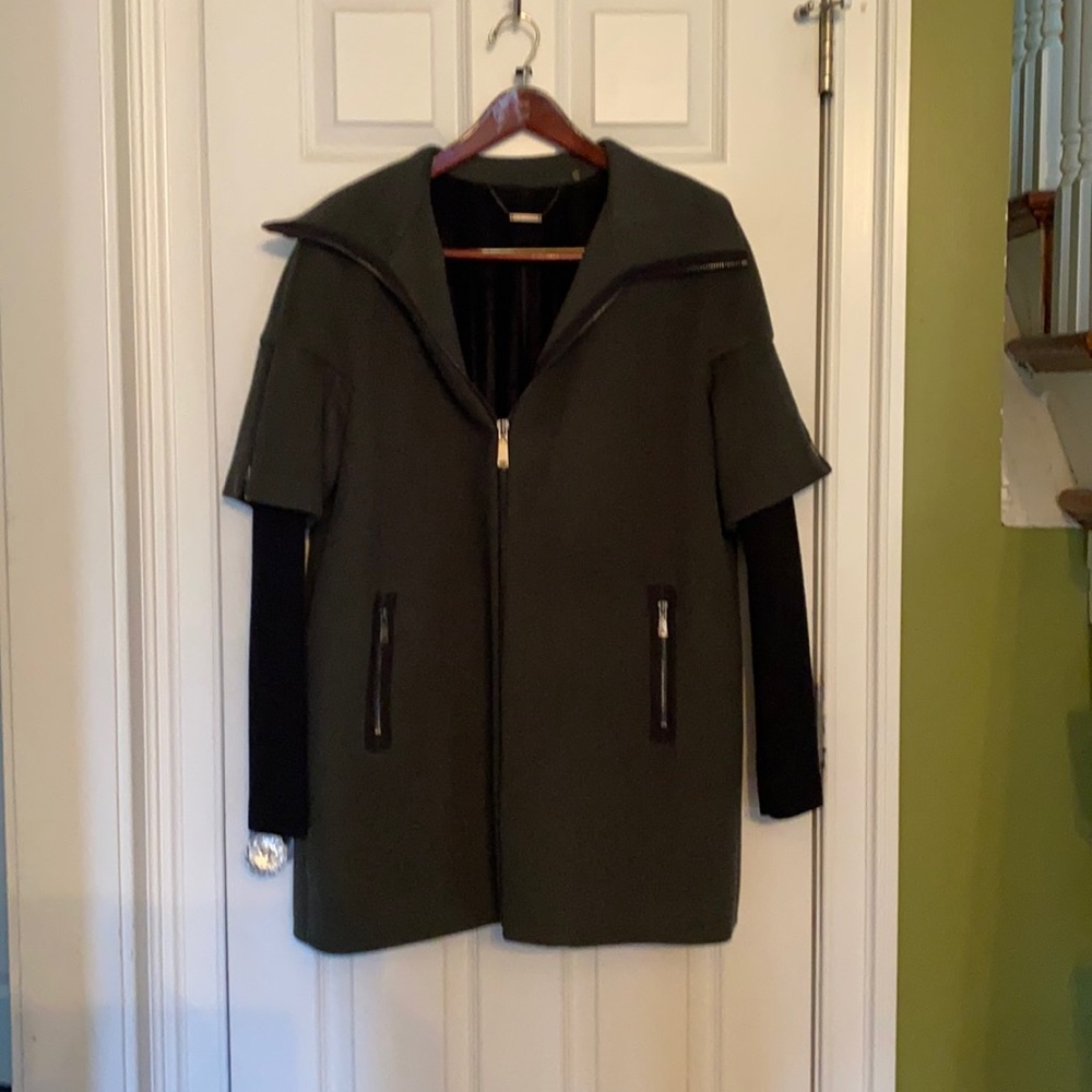 Wool coat with leather trim and sweater sleeves